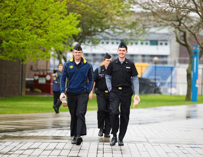 cadets walking on campus in rain