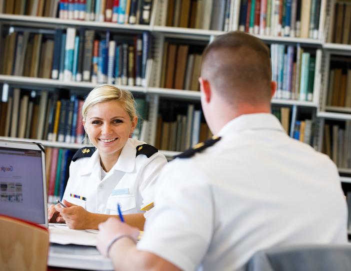 student smiling in the library